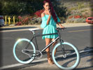 Christina Milian with a Bike wearing Mini Dress