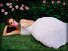 Natalie Portman in a White Dress on the Grass with a Rose